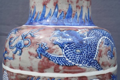 A rare Chinese blue, white and underglaze red rouleau vase, Kangxi